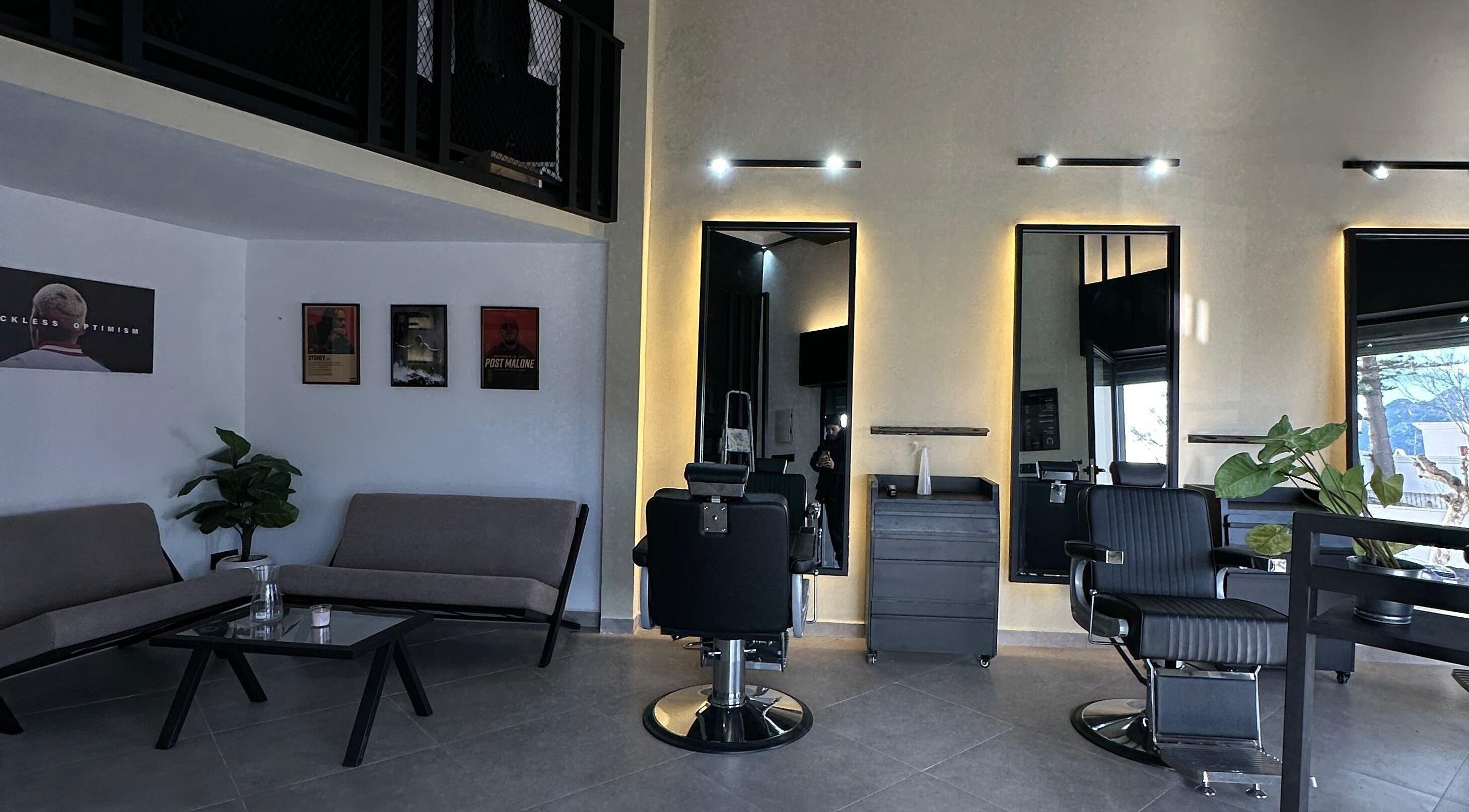Chic interior of Soufian Allal in Tetouan, with stylish chairs and mirrors creating a relaxing ambiance.