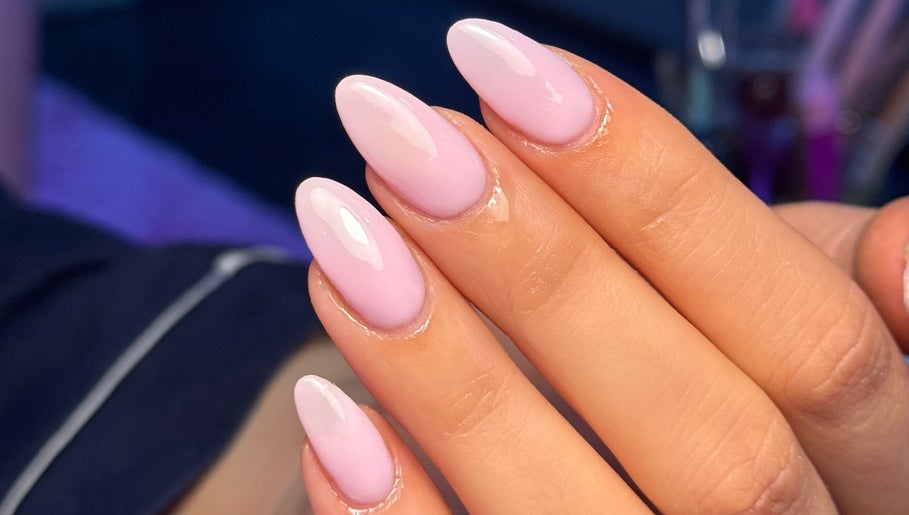 Elegant pink almond nails at MCR Beauty Room, Worsley, England, GB enhancing hand aesthetics.
