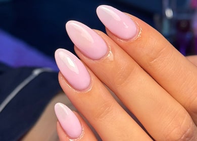 Elegant pink almond nails at MCR Beauty Room, Worsley, England, GB enhancing hand aesthetics.