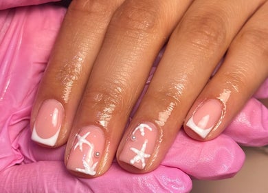 Elegant nail art with pink and white designs at MCR Beauty Room, Worsley, England, GB.