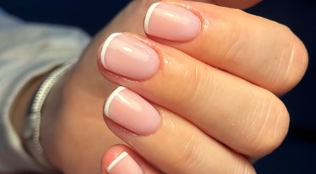 Elegant French manicure at MCR Beauty Room in Worsley, England, GB showcasing precision nail art.