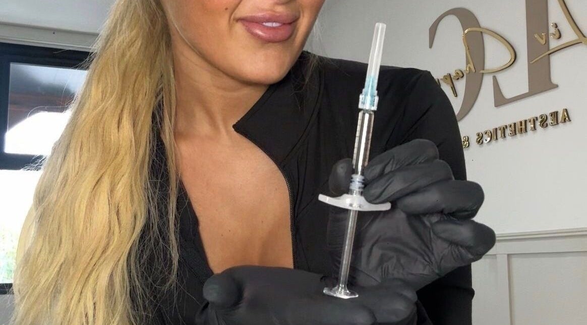 Aesthetician with syringe at Liv Chapman Aesthetics & Nails, Watford, England, GB, offering beauty treatments.