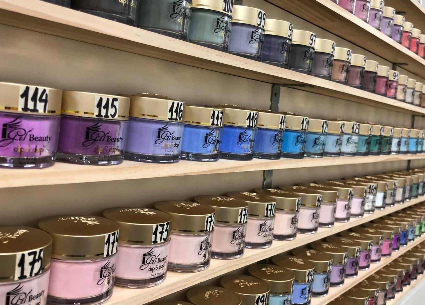 Colorful nail polish jars lined up at Ruby Nails, Palmerston North, Manawatu-wanganui, NZ.