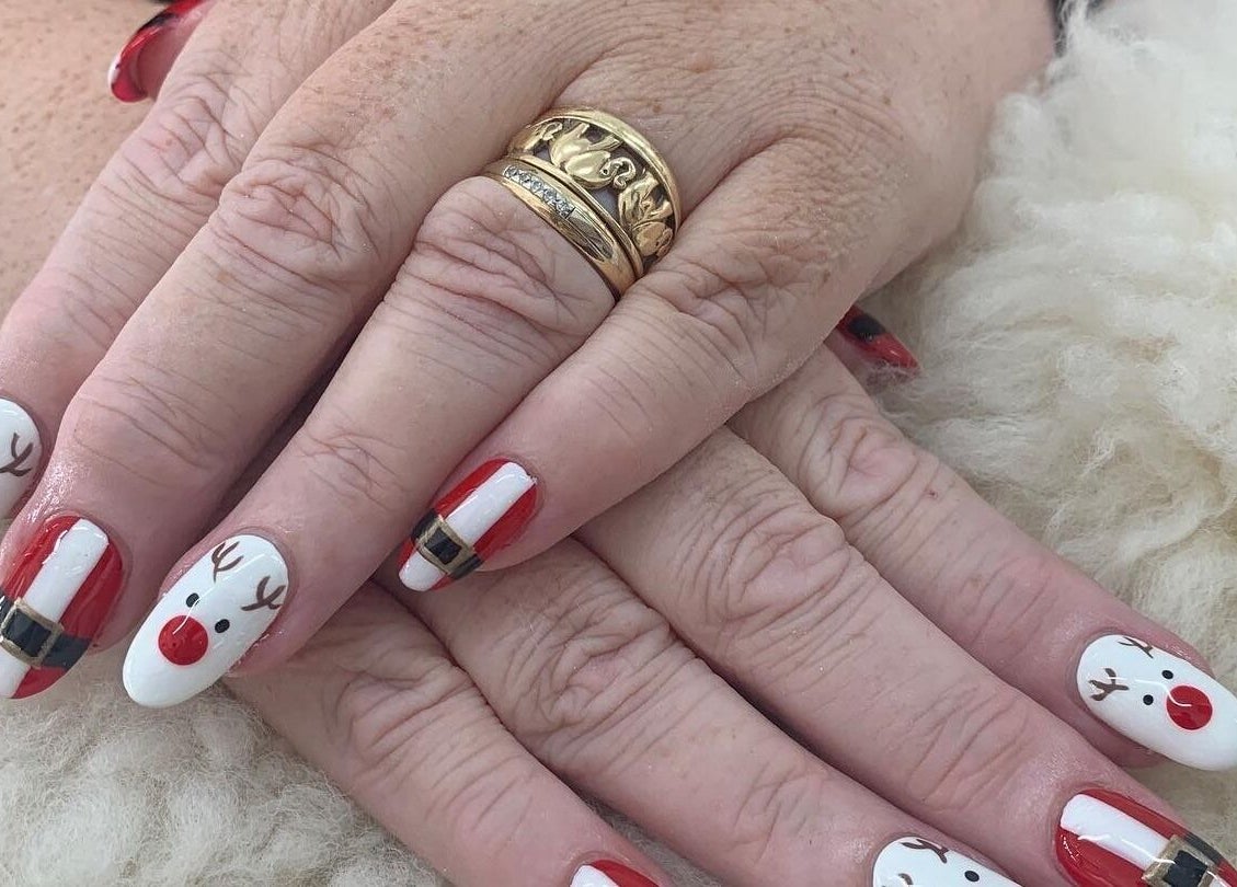 Christmas-themed nail art at Ruby Nails, Palmerston North, Manawatu-wanganui, NZ. Features reindeer designs.