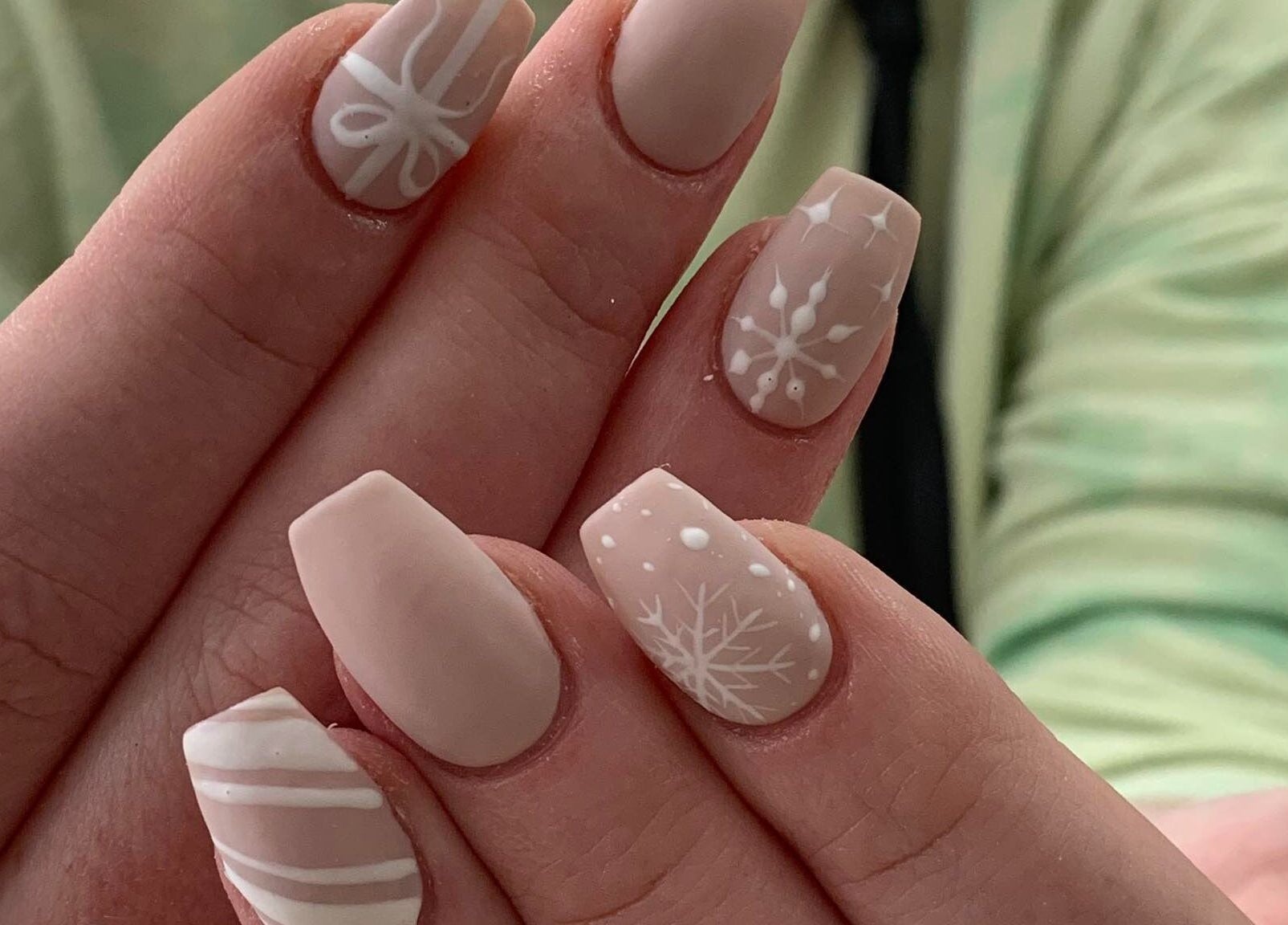 Winter-themed nail art at Ruby Nails, Palmerston North, Manawatu-Wanganui, NZ, featuring delicate snowflake designs.