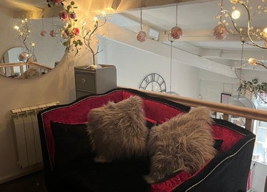 Luxurious seating with soft cushions at Beauty by Laura Jayne, Tutbury, England, GB. Elegant ambiance and decor.