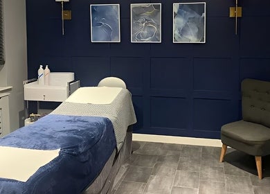 Relaxing treatment room at Natalies Beauty Room, Blandford Forum, England featuring a plush massage bed and calming decor.