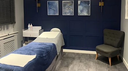Relaxing treatment room at Natalies Beauty Room, Blandford Forum, England featuring a plush massage bed and calming decor.