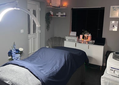 Relaxing treatment room at Natalies Beauty Room, Blandford Forum, England, GB, with cozy bed and ambient lighting.