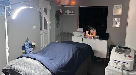 Relaxing treatment room at Natalies Beauty Room, Blandford Forum, England, GB, with cozy bed and ambient lighting.