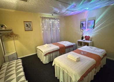 Relaxing massage room at Perfect Massage, Columbus, Ohio, US, with cozy decor and ambient lighting.