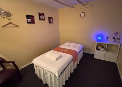 Cozy massage room at Perfect Massage, Columbus, Ohio, US. Features a massage table and calming decor.
