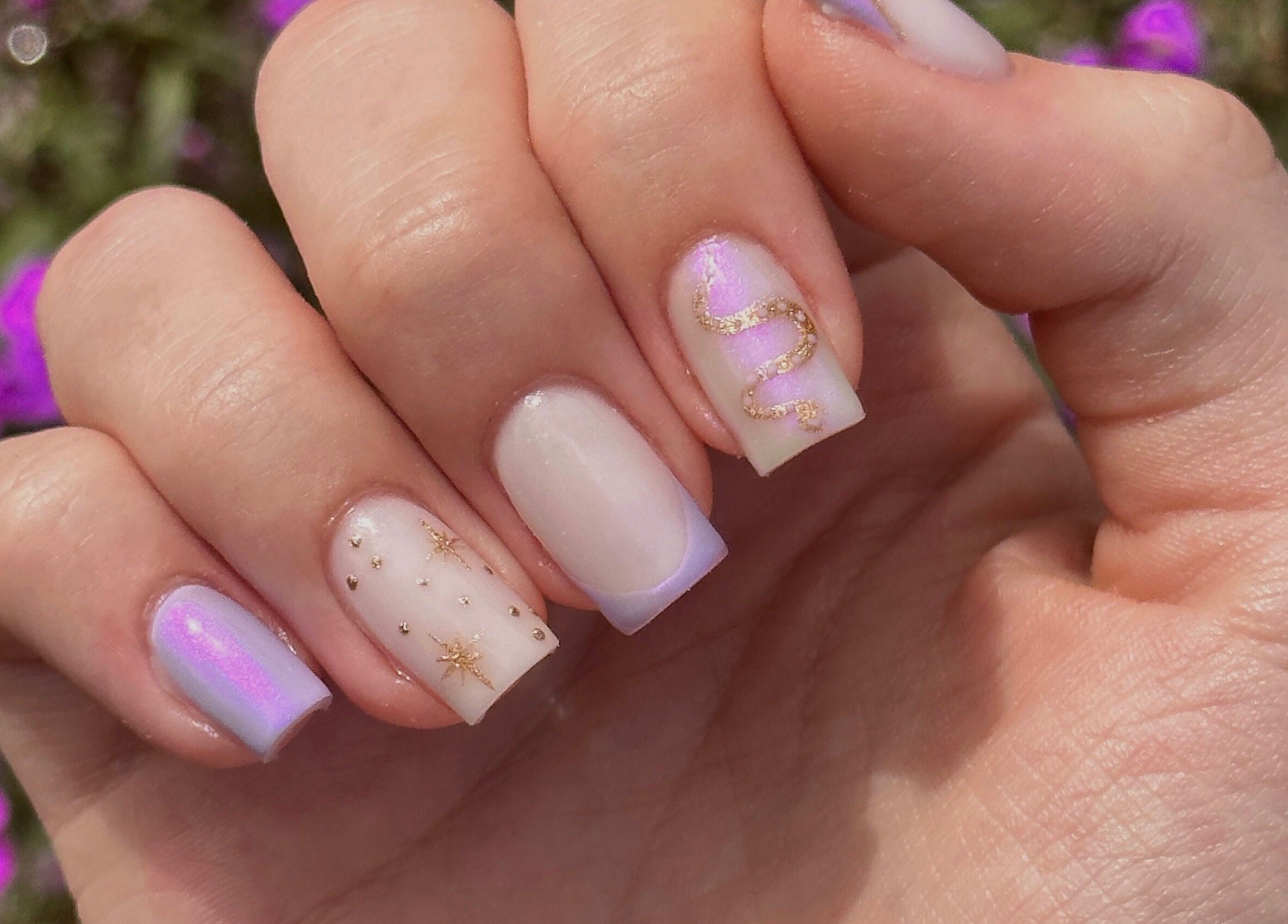 Stylish pastel nails with gold designs at Shape Studios, Cardiff, Wales, GB, showcase elegance and artistry.