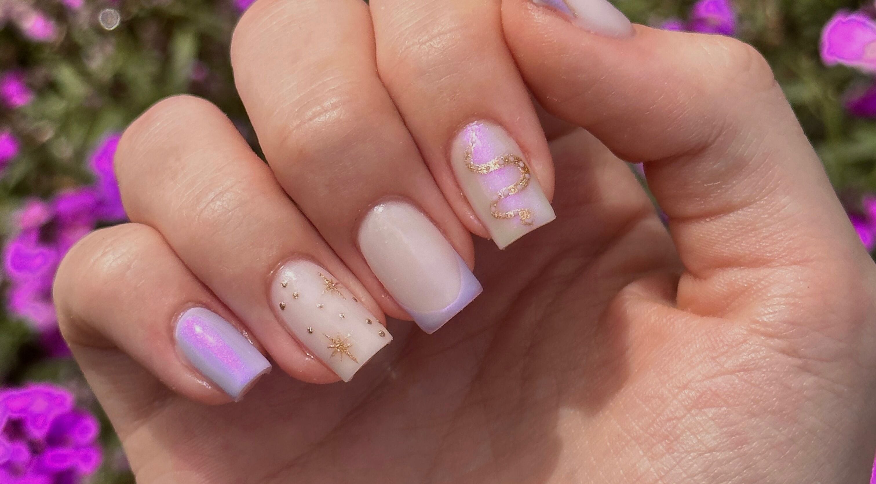 Stylish pastel nails with gold designs at Shape Studios, Cardiff, Wales, GB, showcase elegance and artistry.