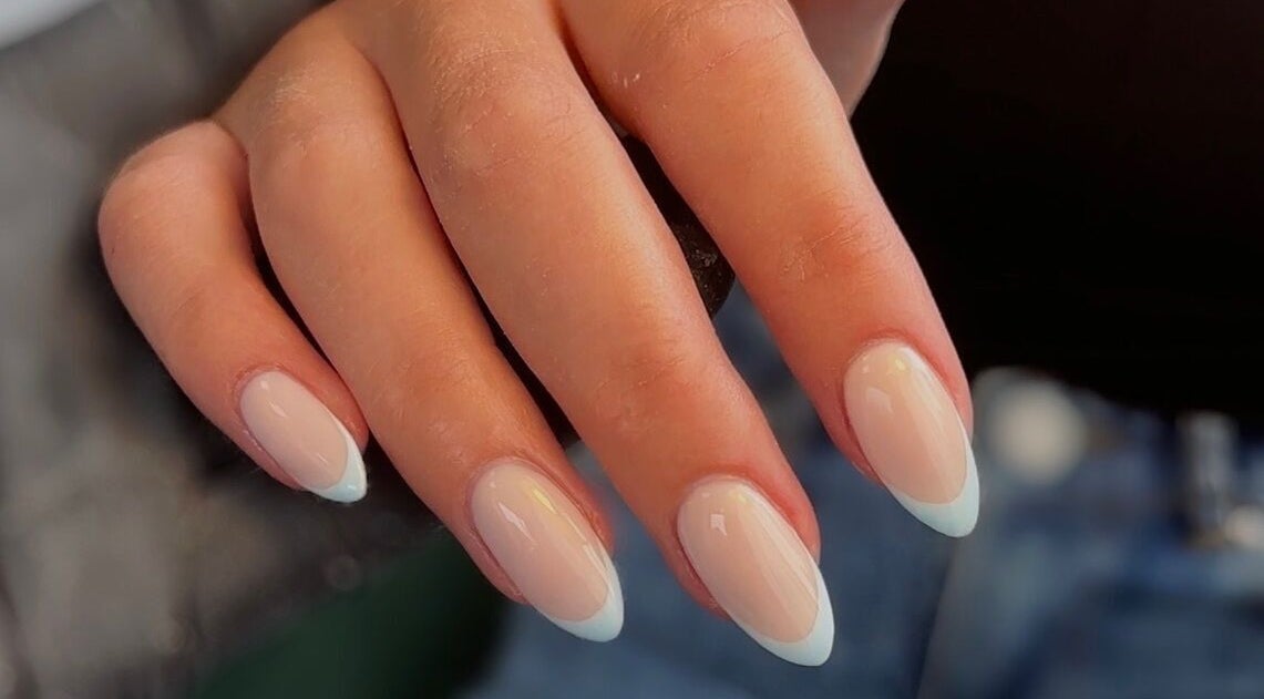 Close-up of manicured nails with pastel tips at Shape Studios, Cardiff, Wales, GB.