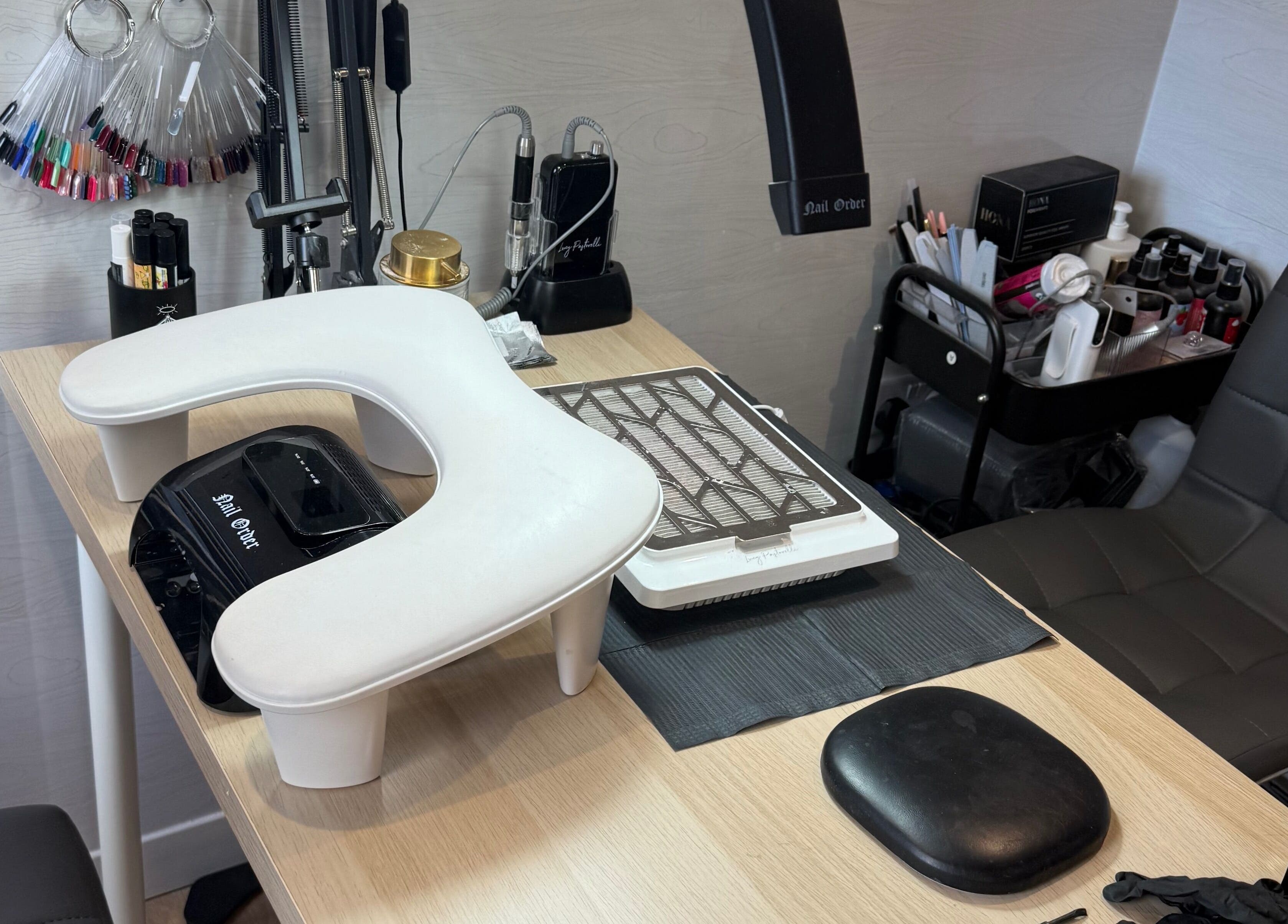 Manicure station at Beauty By Rebecca, Airdrie, Scotland, GB featuring nail polish and tools.