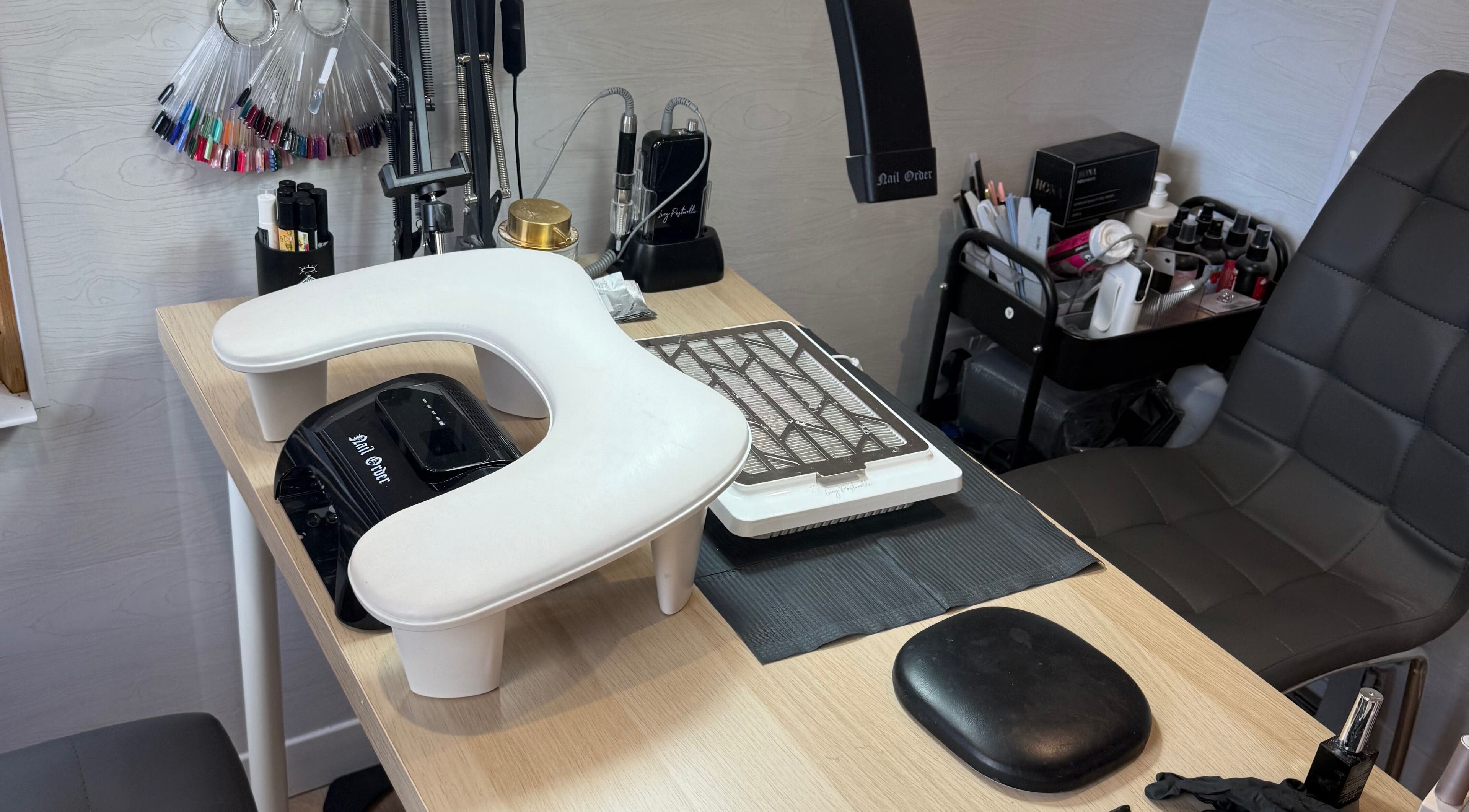 Manicure station at Beauty By Rebecca, Airdrie, Scotland, GB featuring nail polish and tools.