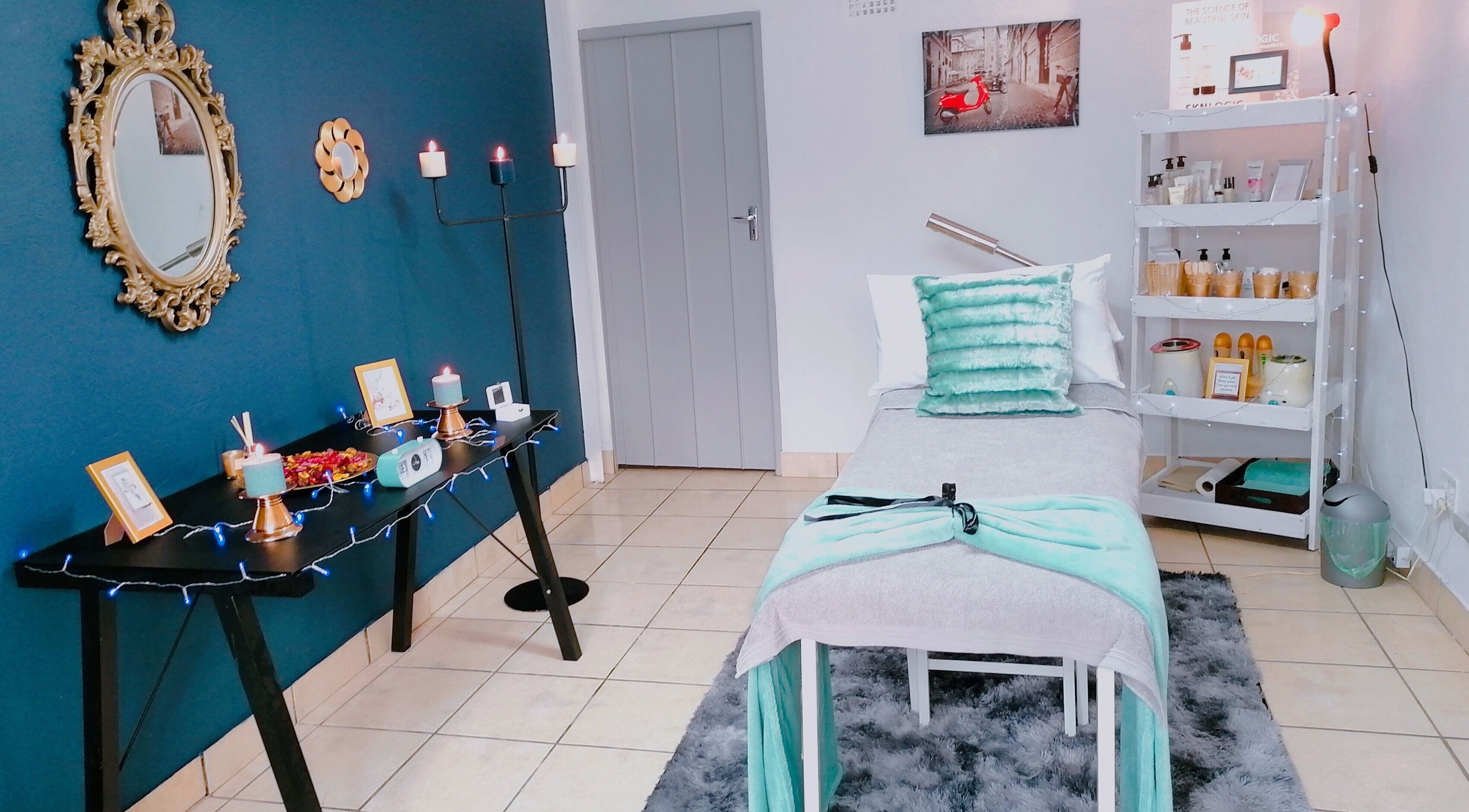 Serene spa room at Red-iculous Beauty and Scents in Hopefield, Western Cape, ZA, with elegant decor and treatment bed.