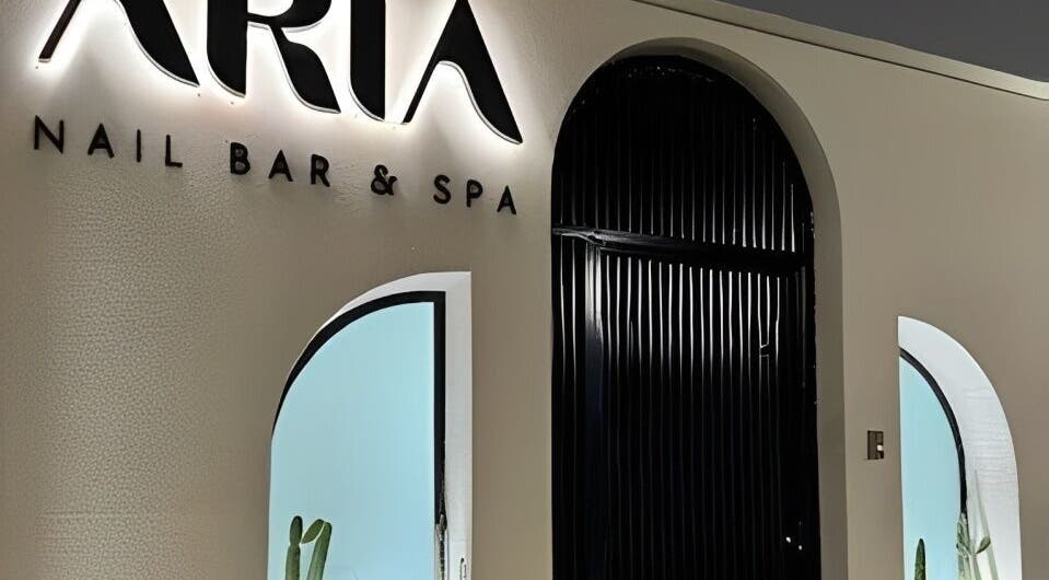 Entrance of Aria Nail Bar and Spa in Al Khobar, Eastern Province, SA, showcasing modern design and welcoming ambiance.