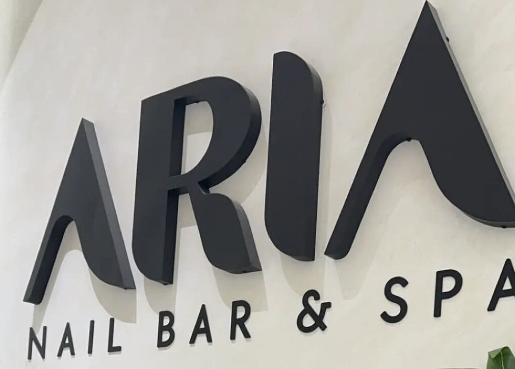 Elegant signage of Aria Nail Bar and Spa in Al Khobar, Eastern Province, SA, welcoming guests.