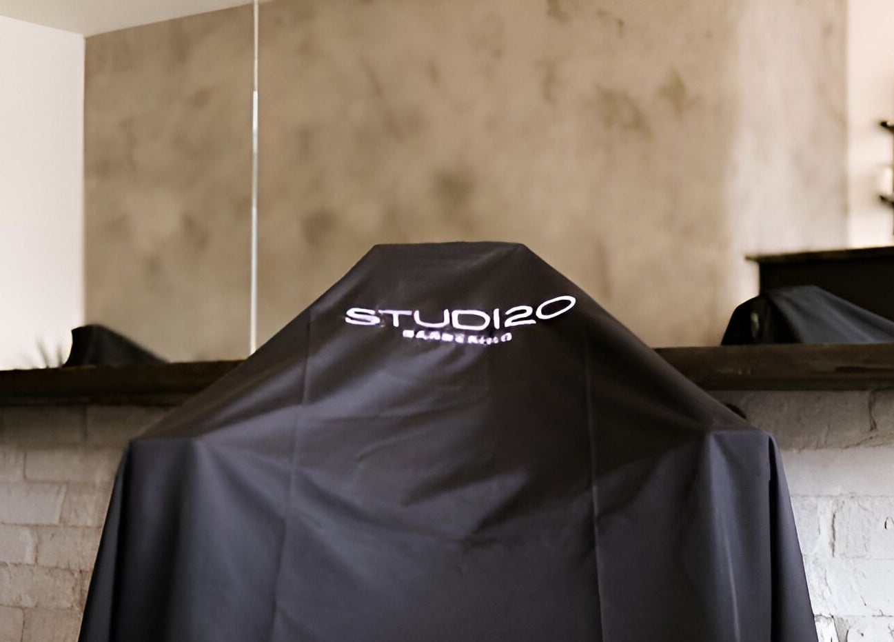 Elegant interior of Studio120 in Bushey, England, featuring stylish mirrors and decor.