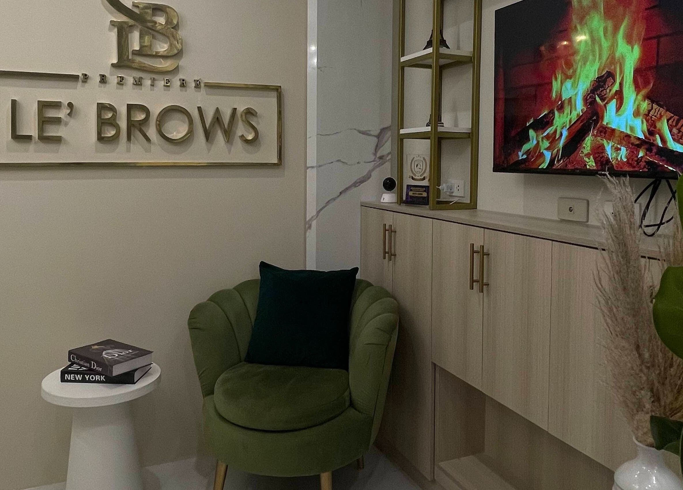 Chic interior at Le’ Brows Premieré in Muntinlupa, Metro Manila, PH featuring elegant seating and decor.