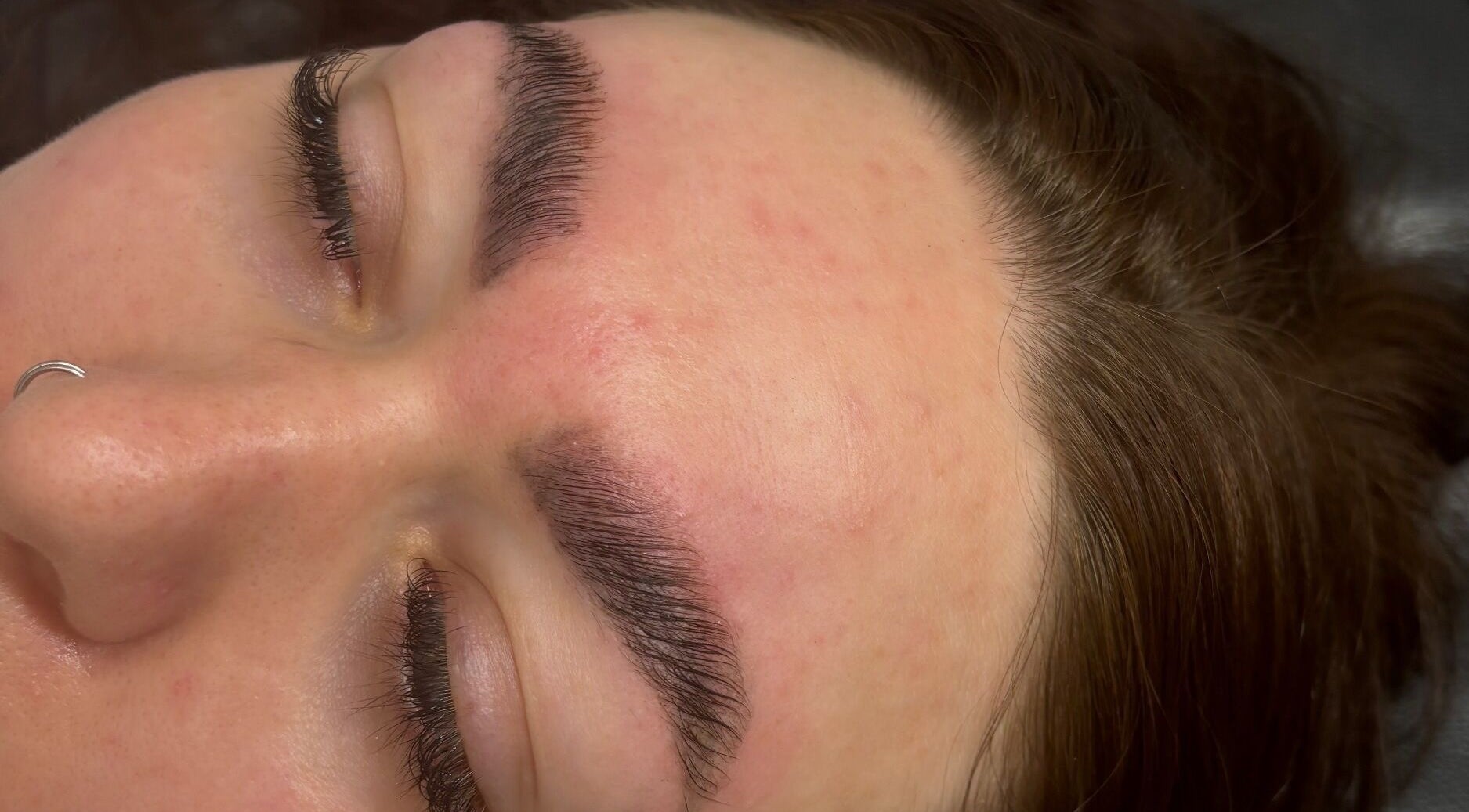 Eyebrow and eyelash styling at Ndlashes, Salford, England, GB. Close-up showcasing beauty enhancement.
