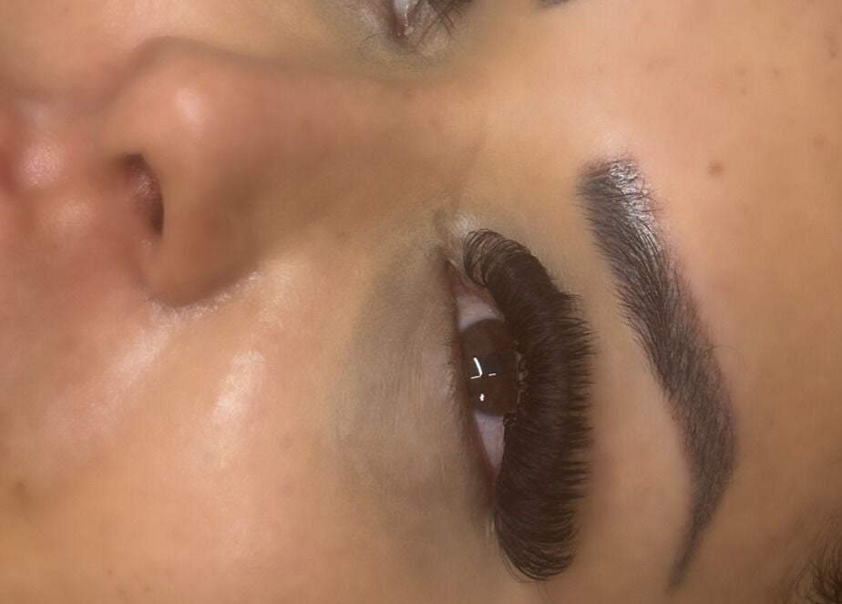 Close-up of a client's lashes at Ndlashes, Salford, England, GB showcasing full and defined eyelashes.