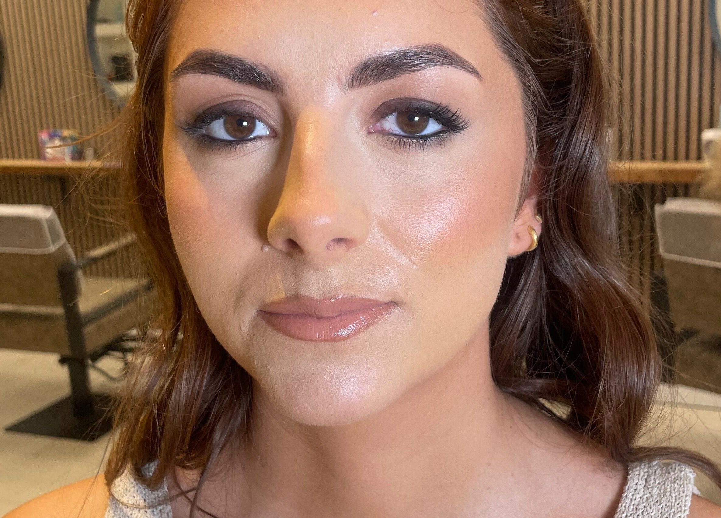 Woman with flawless makeup at Lily Fitz MUA, Longford, County Longford, IE, showcasing beauty expertise.