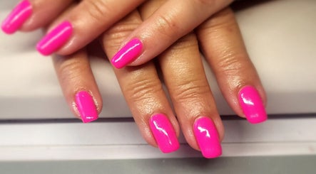 Bright pink manicured nails at Simply Nails and Wellbeing, Crawley, England, GB, showcasing expert design.