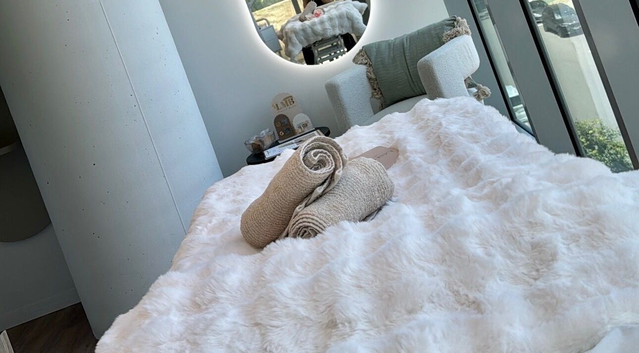 Plush spa bed at La Maison de Beauté - St Leonards, offering luxurious relaxation in St Leonards, NSW, AU.