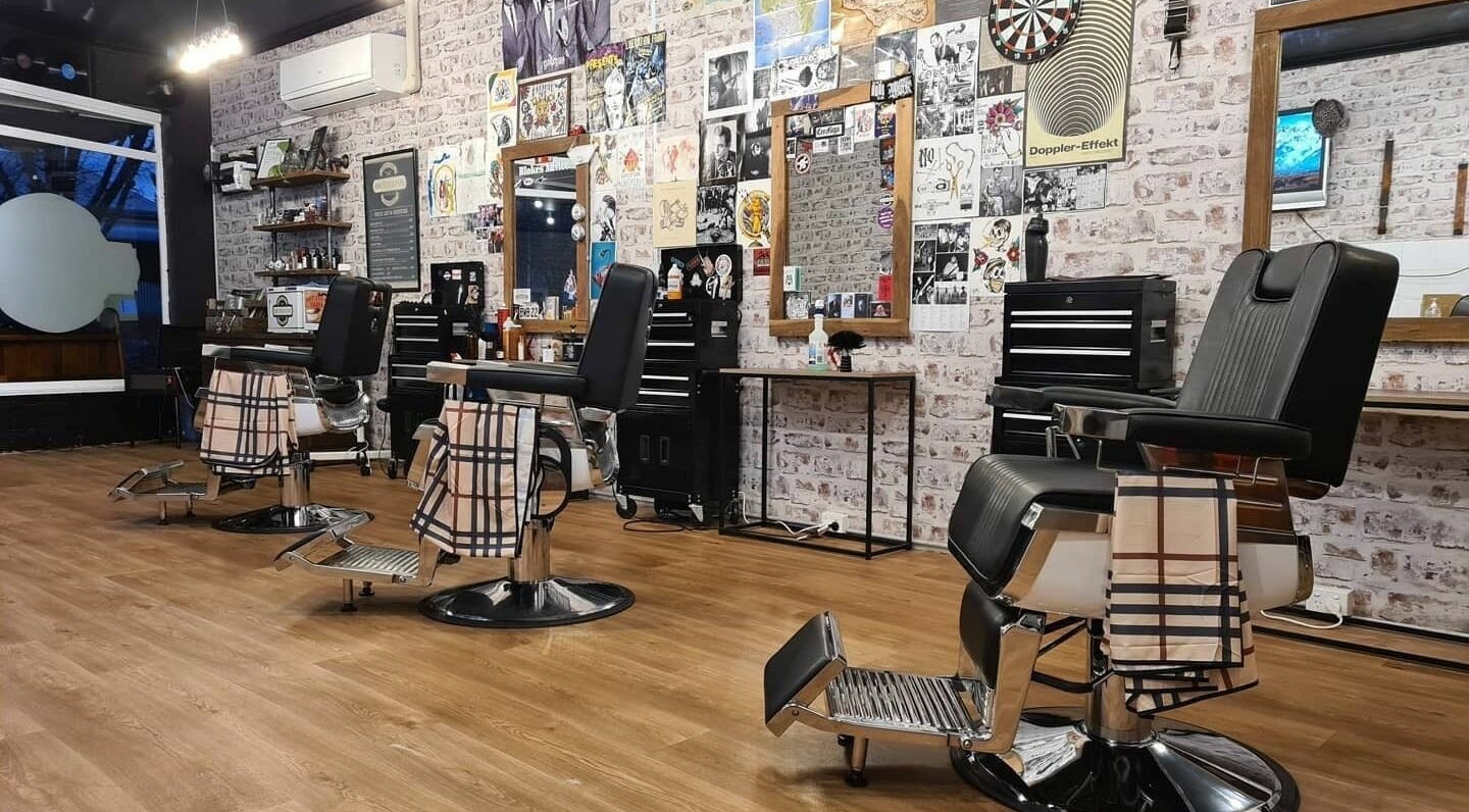 Modern barber chairs at Brother Fox Barbershop, Cowra, New South Wales, AU showcasing sleek design and style.