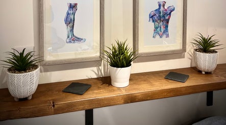 Decor at Sports Massage with Paula, Llandudno Junction, Wales, GB featuring art and plants for a calming ambiance.