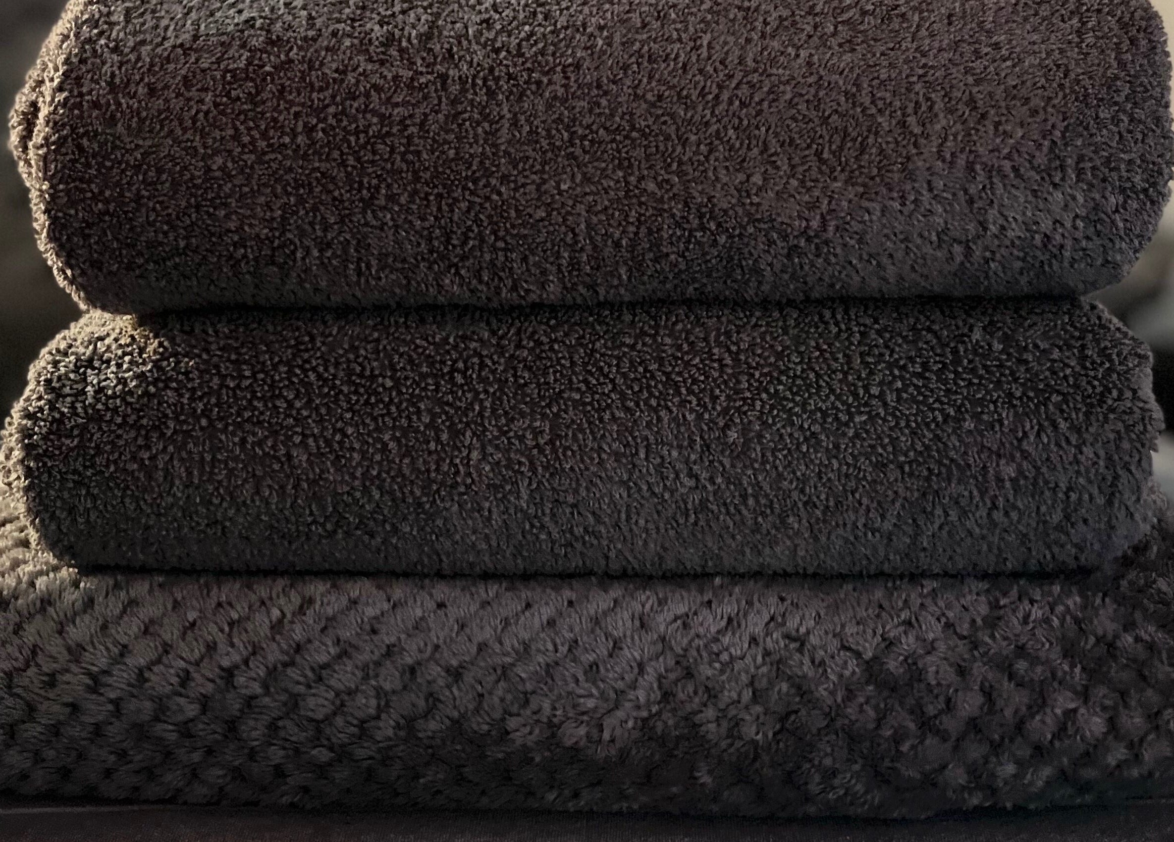 Plush black towels at Sports Massage with Paula, Llandudno Junction, Wales, GB.