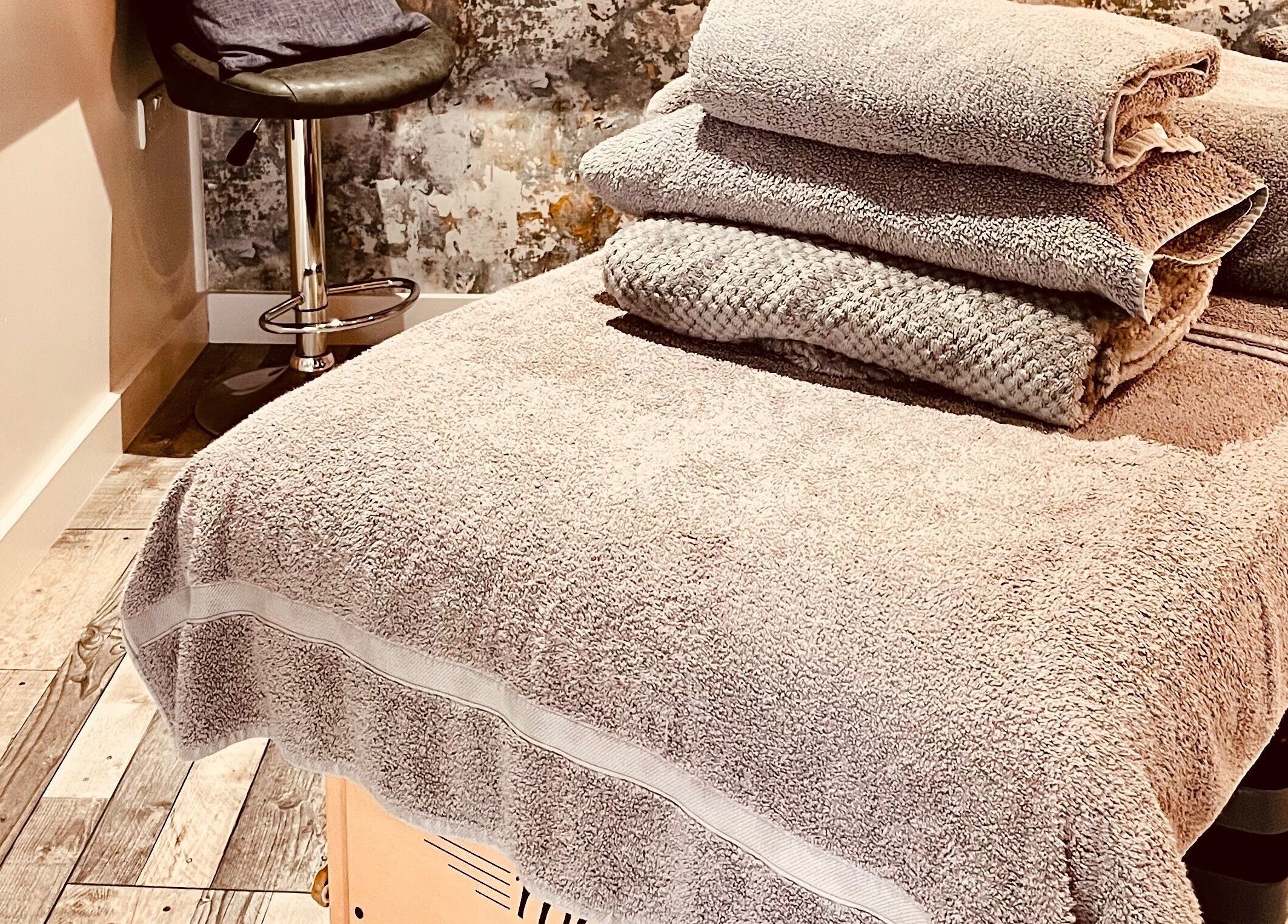 Relaxing massage room at Sports Massage with Paula, Llandudno Junction, Wales, GB with plush towels ready.