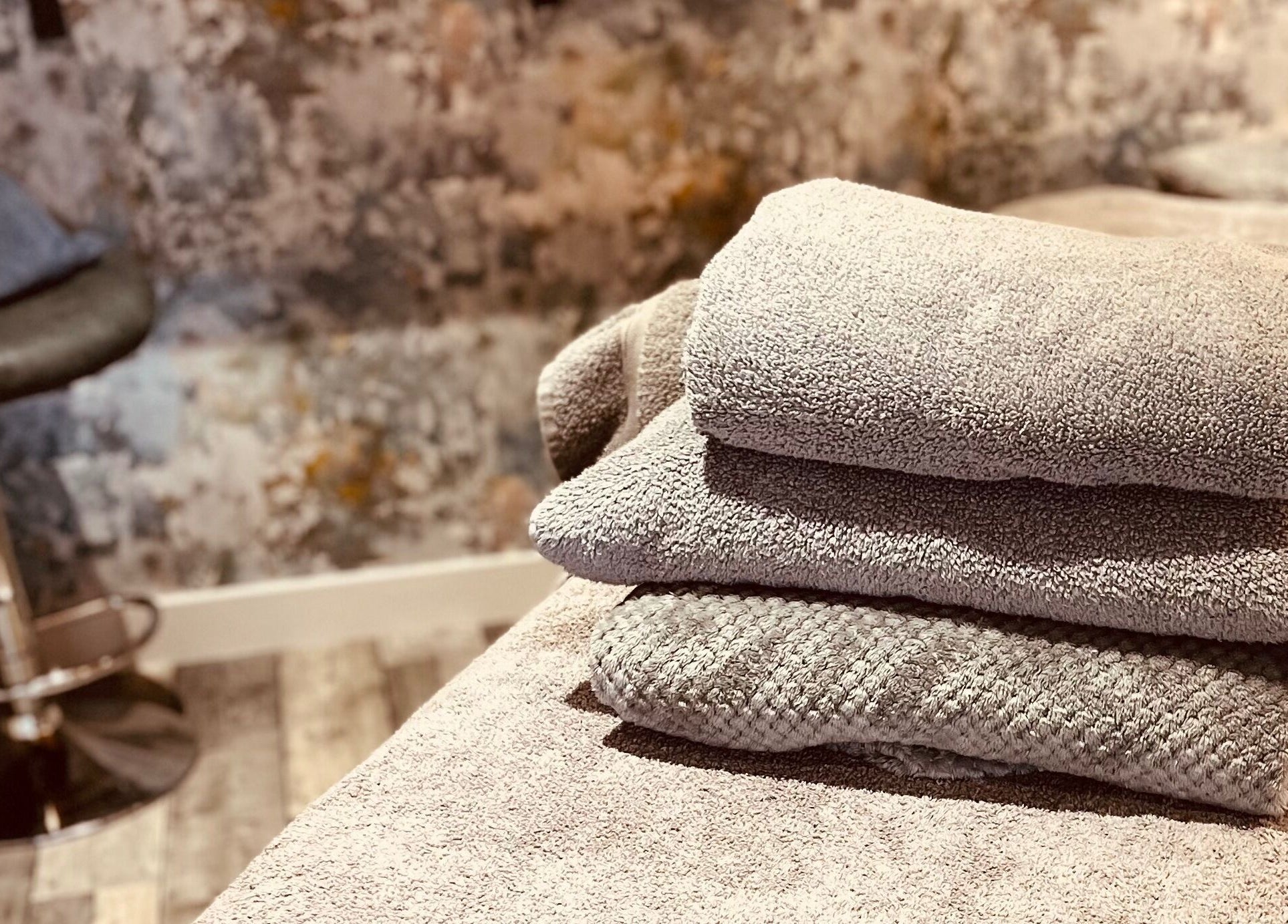 Soft towels on massage table at Sports Massage with Paula, Llandudno Junction, Wales, GB, inviting relaxation.