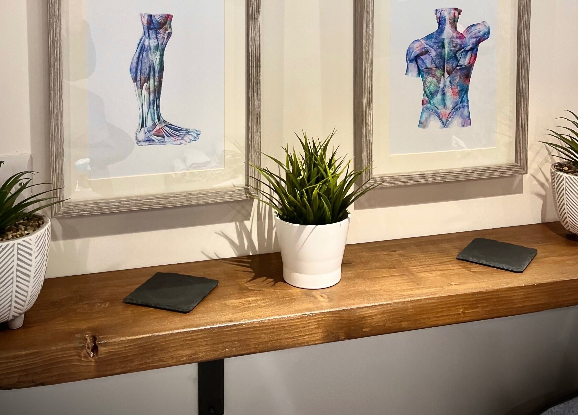 Artwork and plants enhance the serene ambience at Sports Massage with Paula, Llandudno Junction, Wales, GB.
