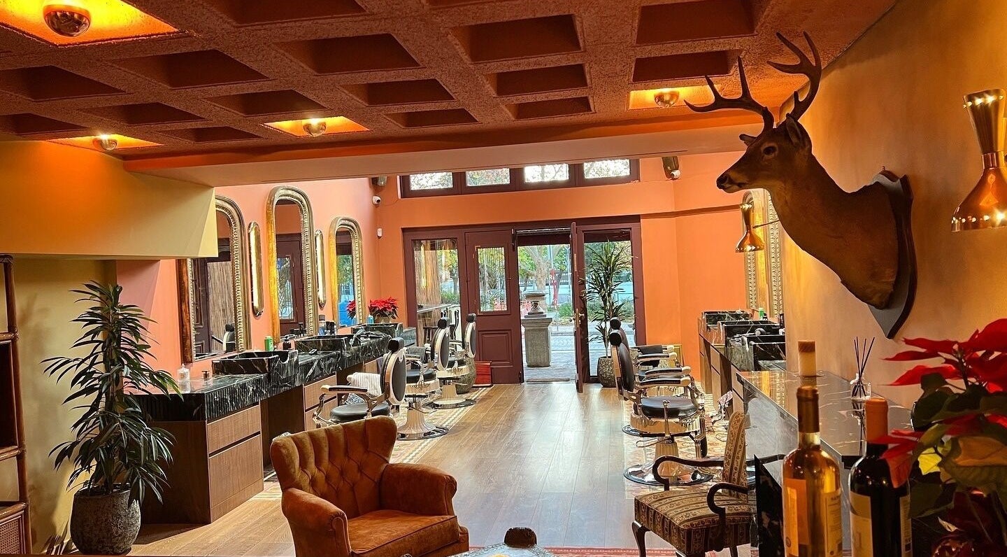 Luxurious interior of Hemingway Gentlemen’s Guild in Iraklio, Athens, GR with stylish decor and seating.