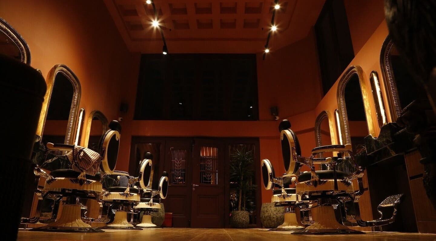 Luxurious interior of Hemingway Gentlemen’s Guild in Iraklio, Athens, GR featuring stylish barber chairs.