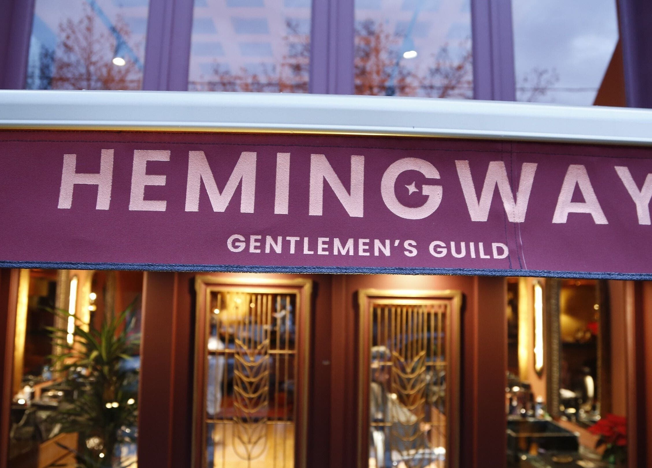 Entrance of Hemingway Gentlemen’s Guild in Iraklio Athens GR with elegant signage.