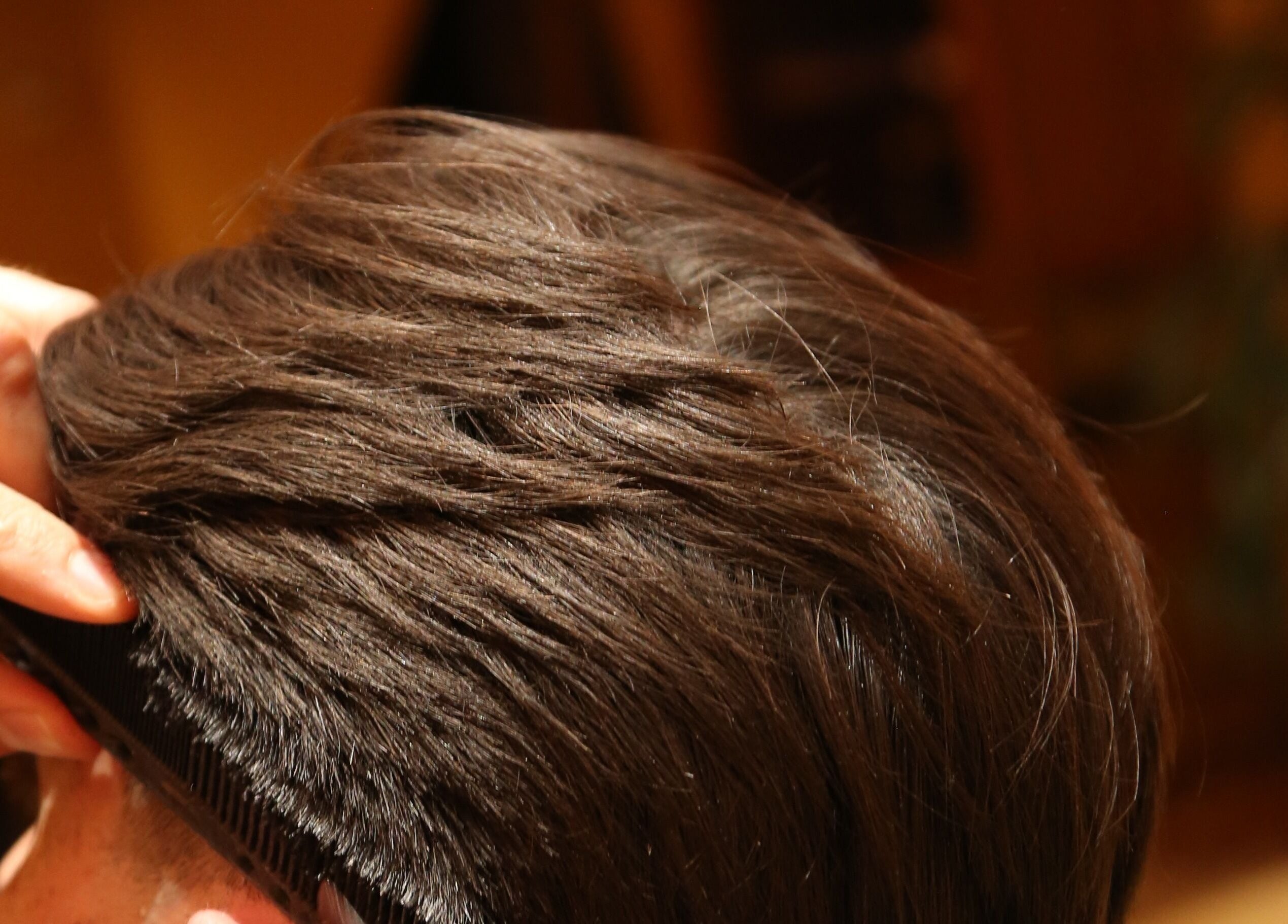 Haircut process at Hemingway Gentlemen’s Guild, Iraklio, Athens, GR, showcasing precise styling.