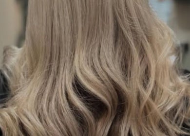 Blonde wavy hairstyle from Hair Lounge With Ferne in Ash, England, GB, showcasing expert styling techniques.