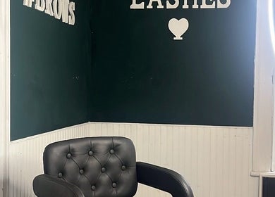 Cozy salon interior at Leigh B Makeup & Brows in Drogheda, County Louth, IE, featuring a black chair and lush decor.