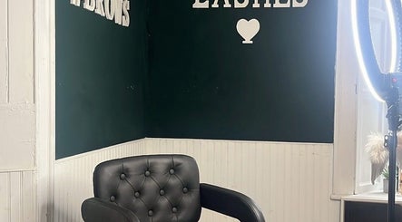 Cozy salon interior at Leigh B Makeup & Brows in Drogheda, County Louth, IE, featuring a black chair and lush decor.