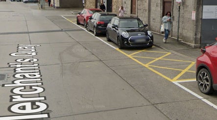 Street view near Leigh B Makeup & Brows Artist, Drogheda, County Louth, IE, showcasing parked vehicles.
