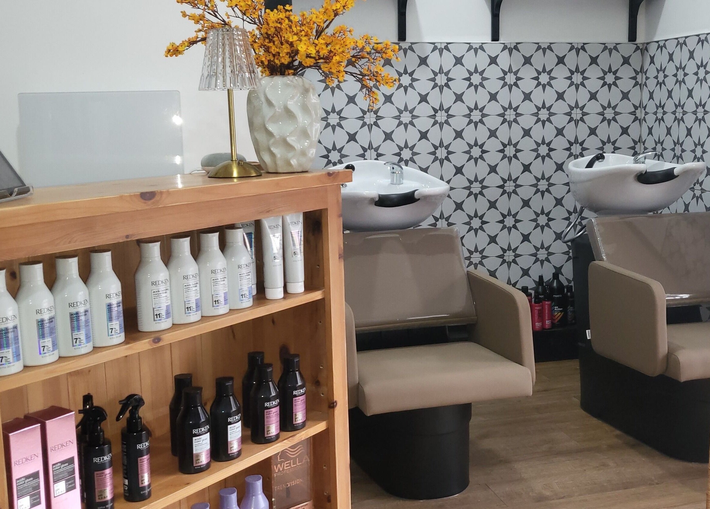 Stylish salon interior at Luna & Co. in Celbridge, County Kildare, IE, featuring wash stations and product shelves.