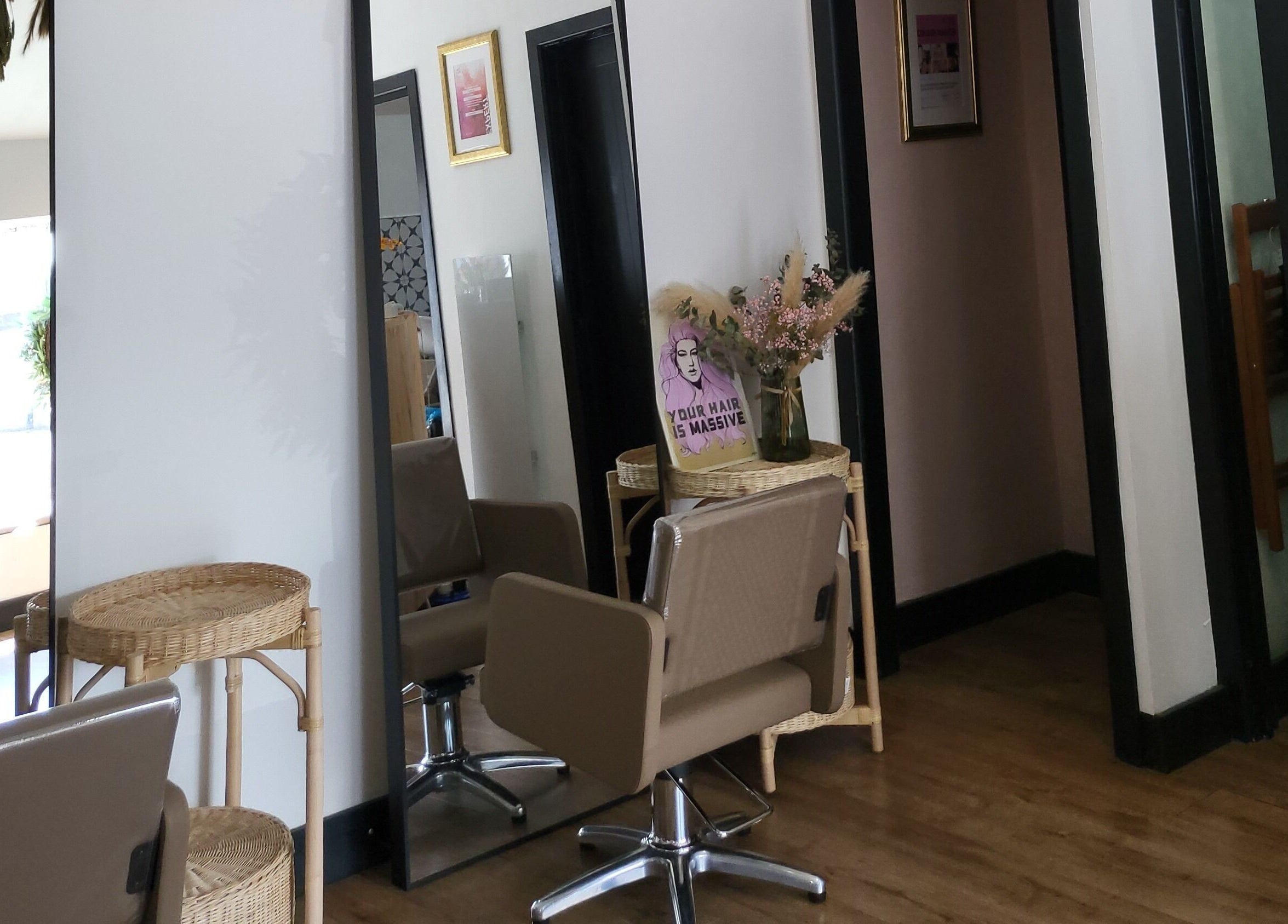 Stylish salon interior at Luna & Co., Celbridge, County Kildare, IE, featuring modern chairs and floral decor.