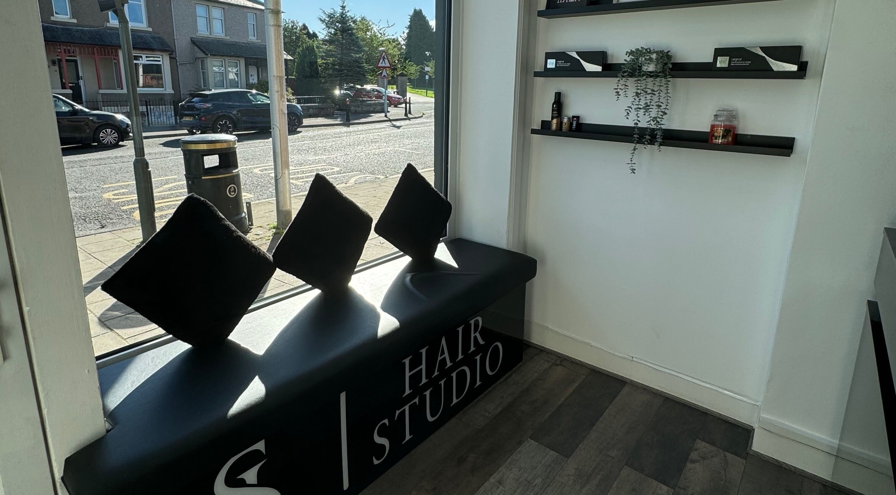 Cozy seating at S & L Hair Studio, Newtongrange, Scotland, GB with stylish interior decor.