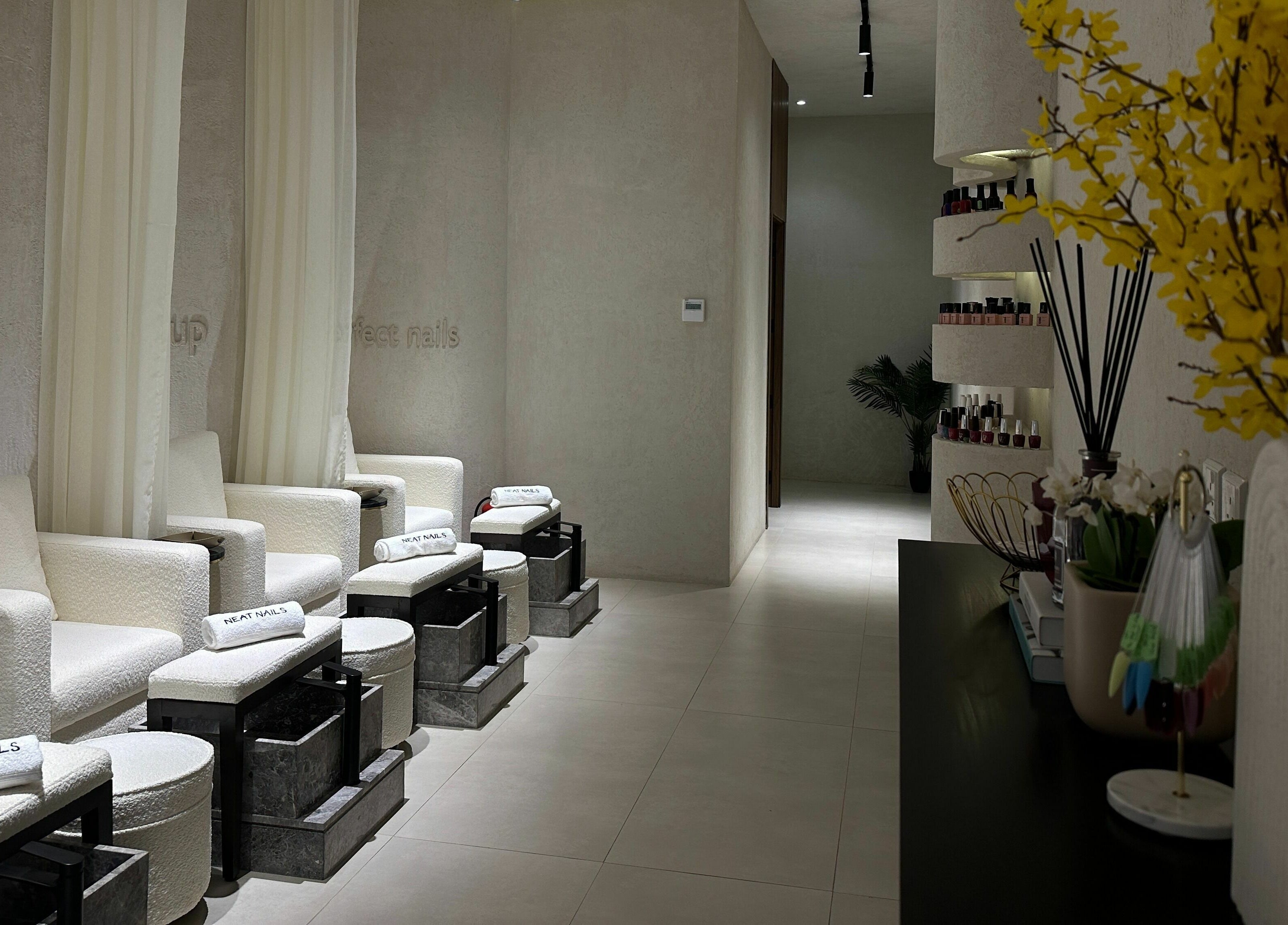 Luxurious seating area at Neat Nails - صالون الأظافر المرتبة, Riyadh, Riyadh Province, SA, with plush chairs and decor.