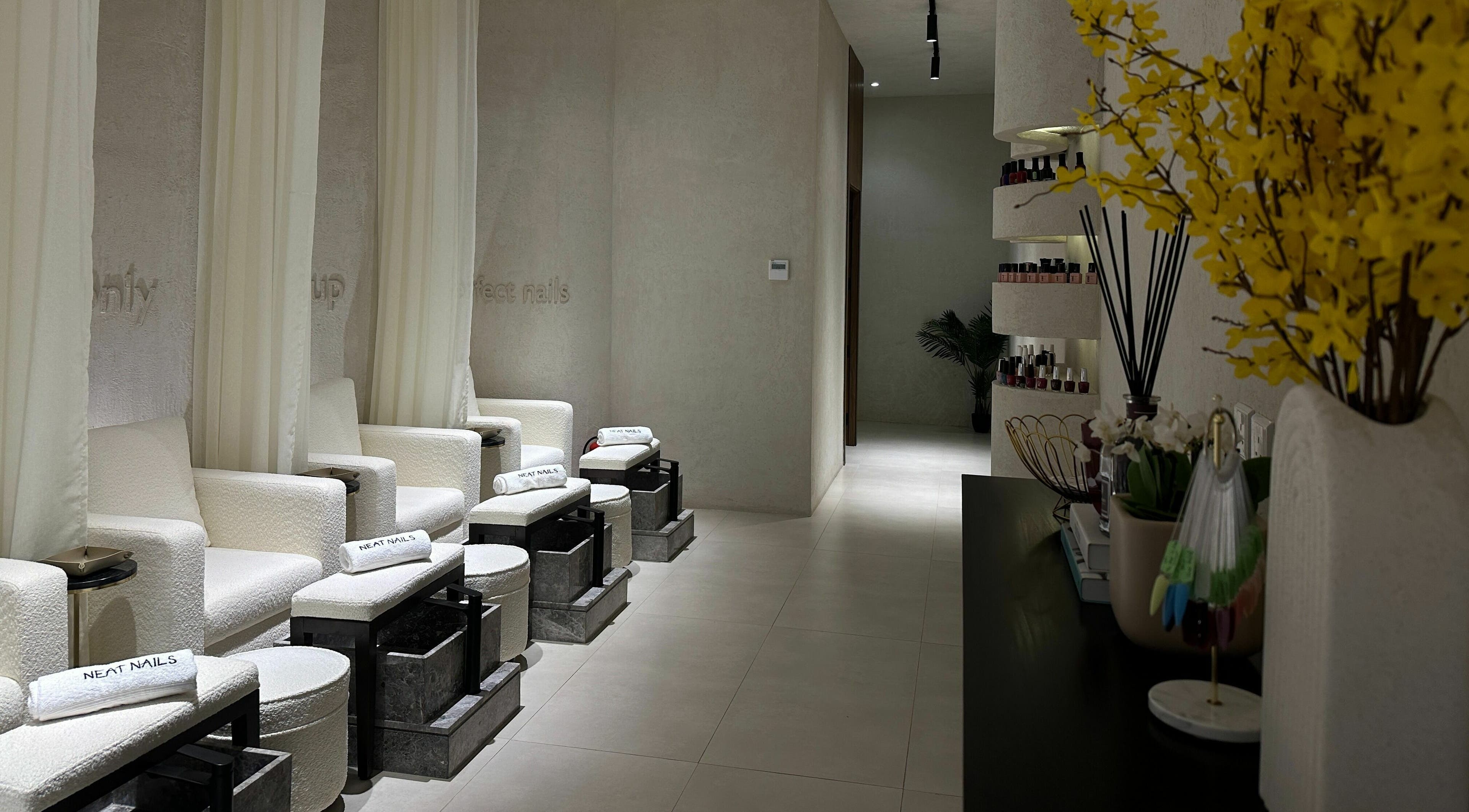 Luxurious seating area at Neat Nails - صالون الأظافر المرتبة, Riyadh, Riyadh Province, SA, with plush chairs and decor.